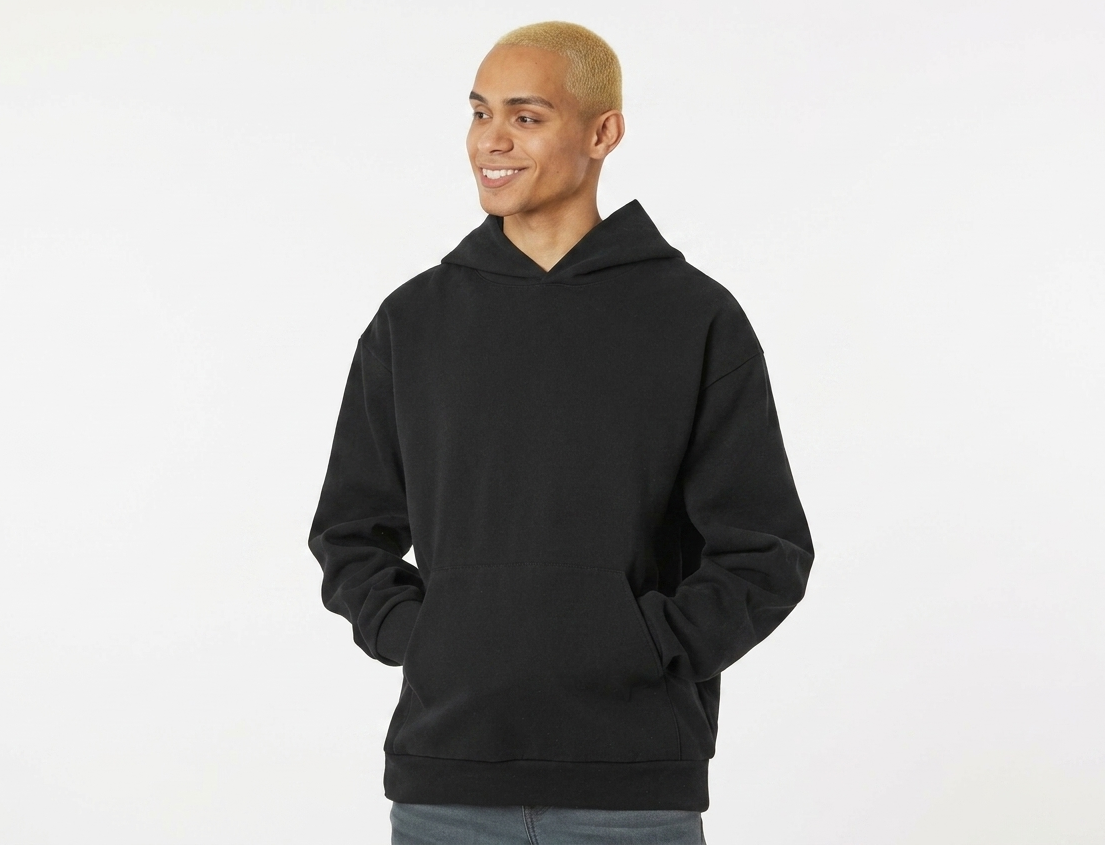 Person wearing a black hoodie on a white background
